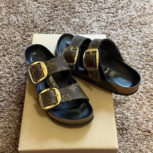 Birkenstock's wrapped in authentic Louis Vuitton leather.